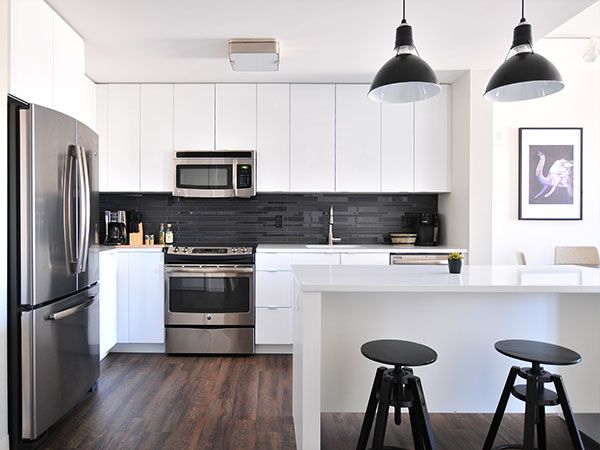 Un espace cuisine efficace et optimisé après de la rénovation Un espace cuisine efficace et optimisé après de la rénovation